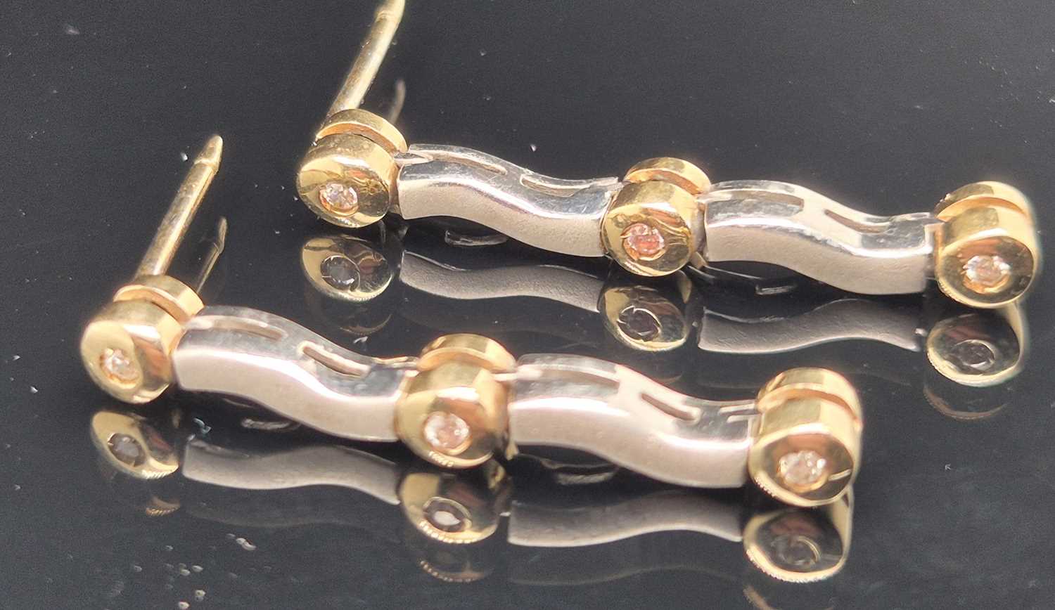 Lot 94 - A pair of gemset yellow and white gold drop...