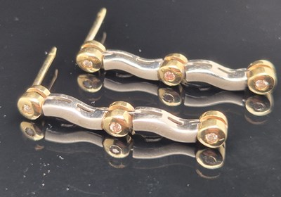 Lot 94 - A pair of gemset yellow and white gold drop...