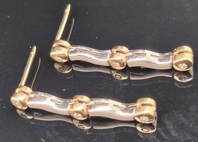 Lot 94 - A pair of gemset yellow and white gold drop...