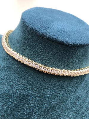 Lot 95 - A cz set tennis bracelet. Length 18.5 cm....