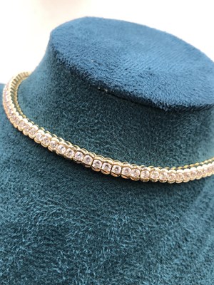 Lot 95 - A cz set tennis bracelet. Length 18.5 cm....