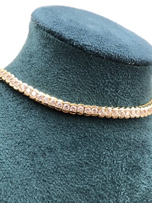 Lot 95 - A cz set tennis bracelet. Length 18.5 cm....