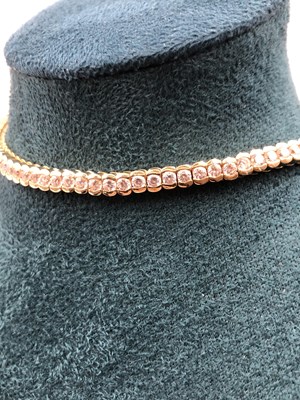 Lot 95 - A cz set tennis bracelet. Length 18.5 cm....