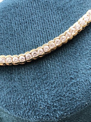 Lot 95 - A cz set tennis bracelet. Length 18.5 cm....