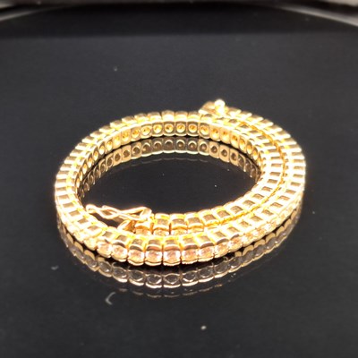 Lot 95 - A cz set tennis bracelet. Length 18.5 cm....