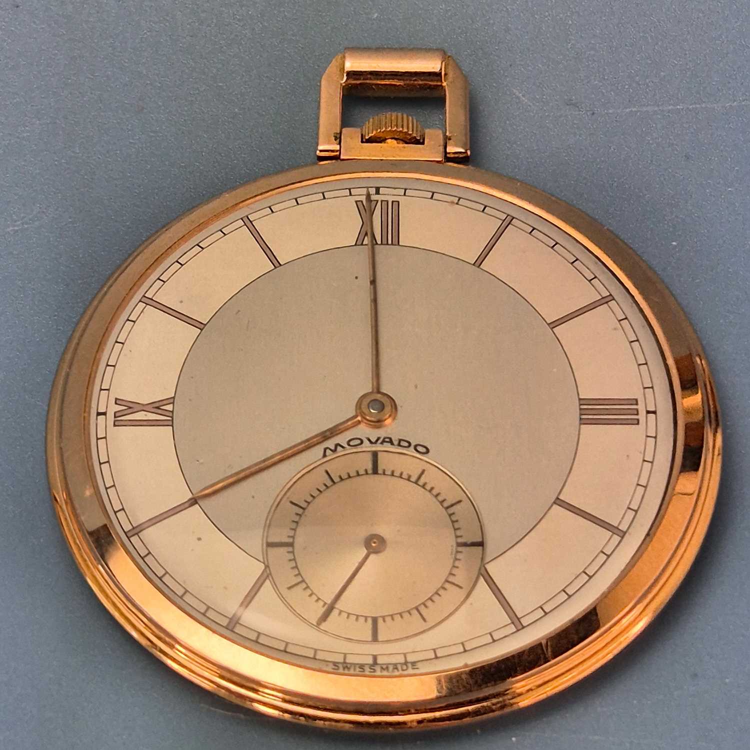 Lot 552 - A Movado 18ct gold slimline pocket watch with...