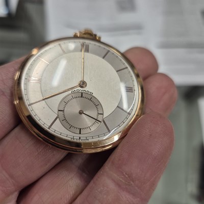 Lot 552 - A Movado 18ct gold slimline pocket watch with...
