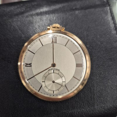 Lot 552 - A Movado 18ct gold slimline pocket watch with...