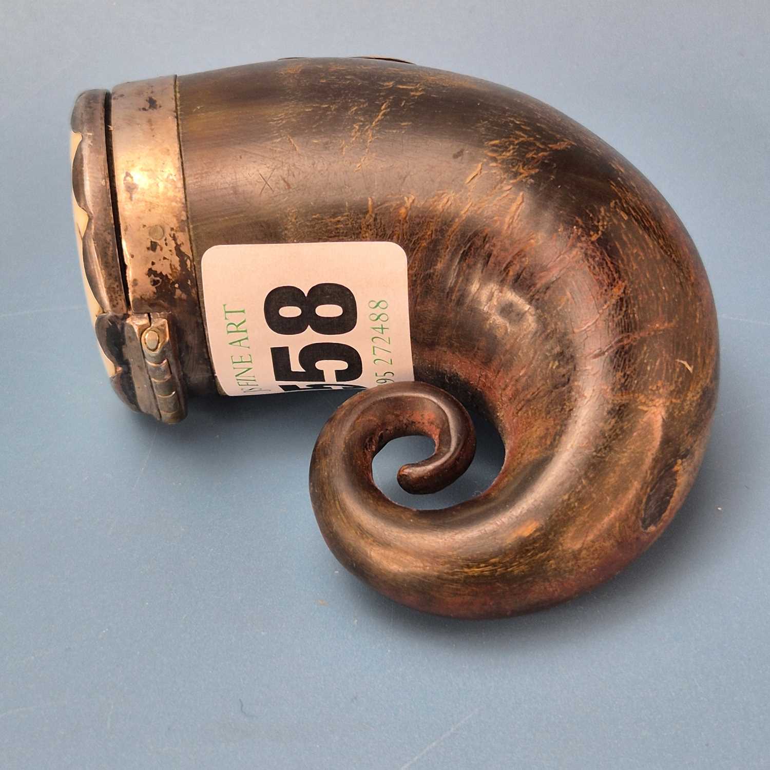 Lot 558 - A 19th century horn snuff mull, with silver...