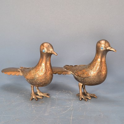 Lot 560 - A pair of antique Indian silvered copper...