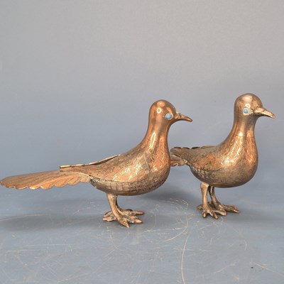 Lot 560 - A pair of antique Indian silvered copper...