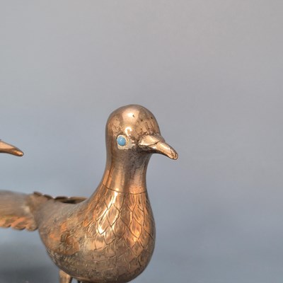 Lot 560 - A pair of antique Indian silvered copper...
