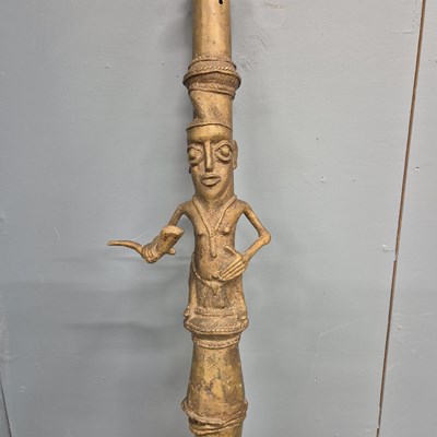 Lot 562 - A Benin bronze ceremonial pipe, the mask bowl...