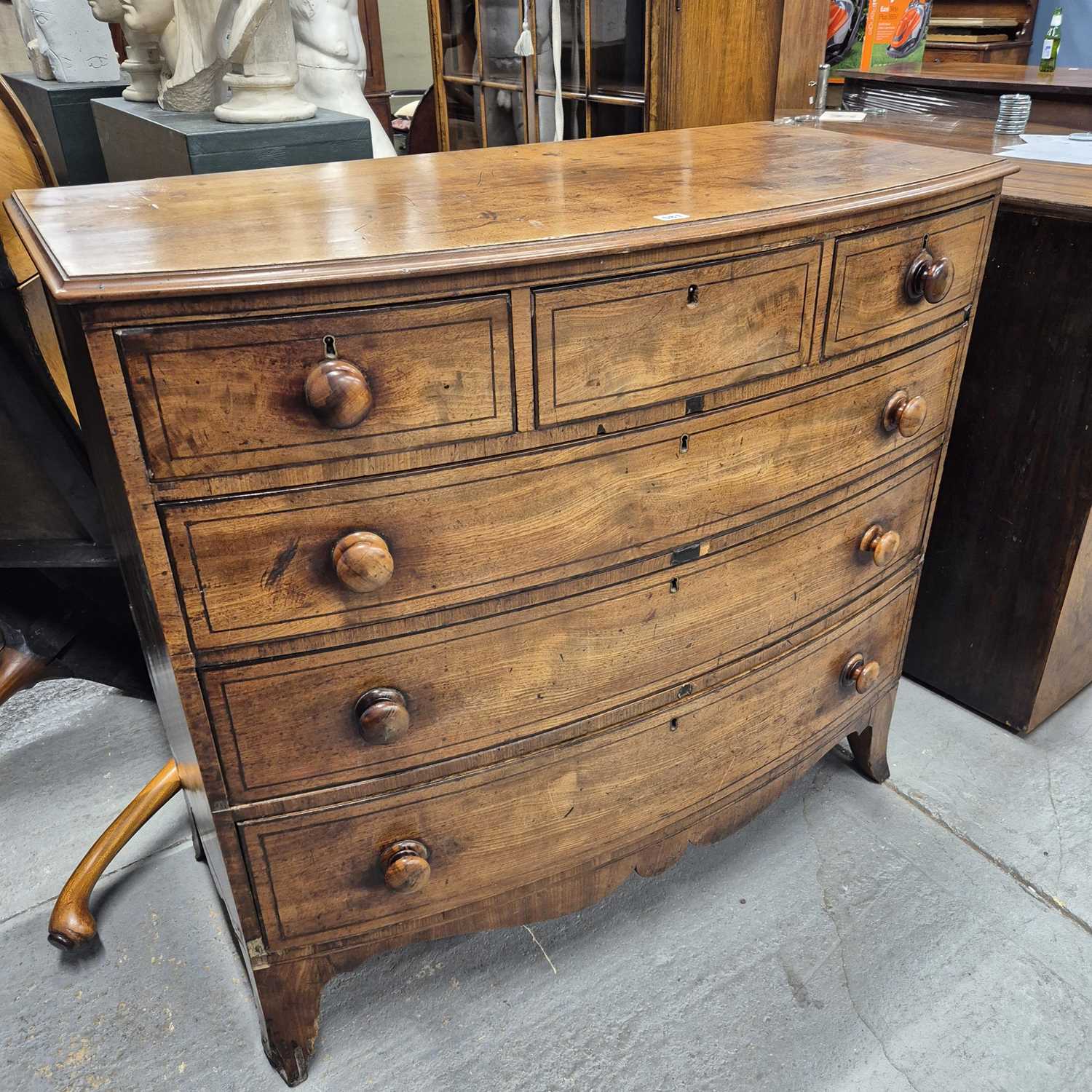 Lot 581 - An ebony line inlaid mahogany bow front chest...