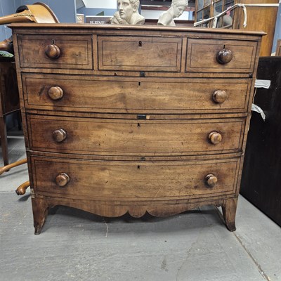 Lot 581 - An ebony line inlaid mahogany bow front chest...
