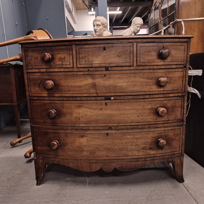 Lot 581 - An ebony line inlaid mahogany bow front chest...