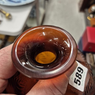 Lot 589 - A Lalique Feuilles Votive pattern amber glass...