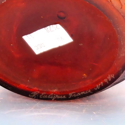Lot 589 - A Lalique Feuilles Votive pattern amber glass...