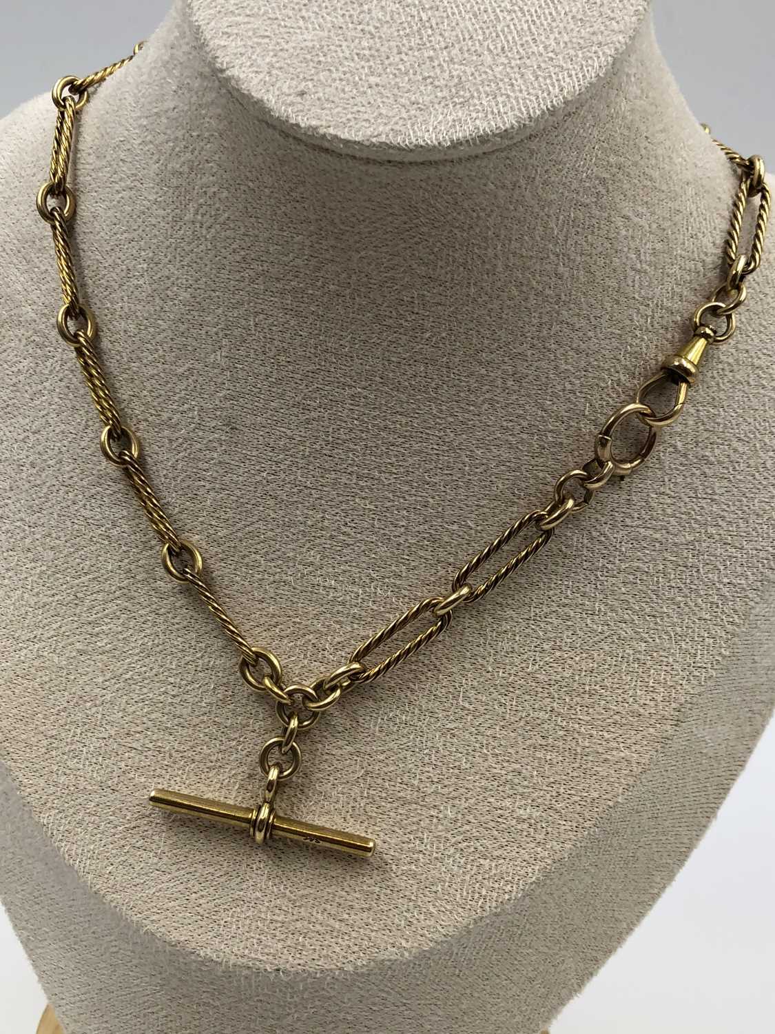 Lot 539 - An antique 15-carat gold watch Albert chain...