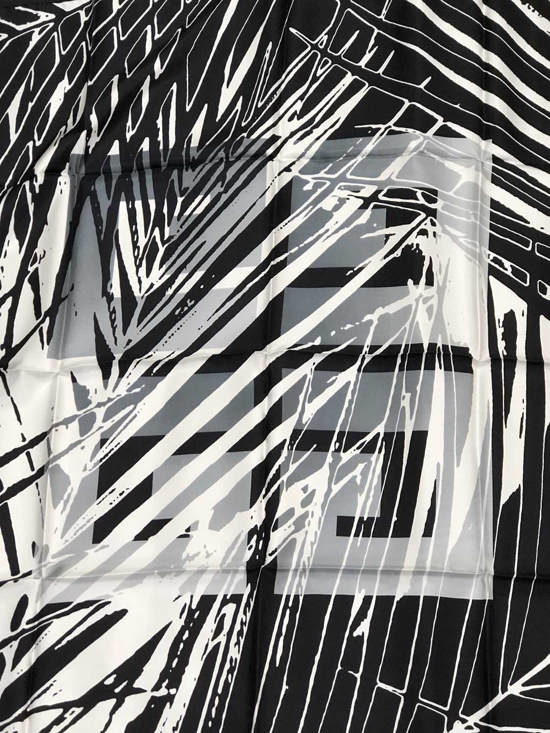 Lot 1117 - Givenchy, a vintage silk scarf. Black, white...