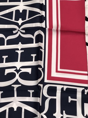Lot 1130 - A pink and navy Jaeger logo silk scarf,...