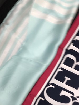 Lot 1130 - A pink and navy Jaeger logo silk scarf,...