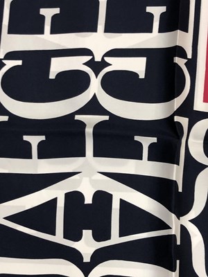 Lot 1130 - A pink and navy Jaeger logo silk scarf,...