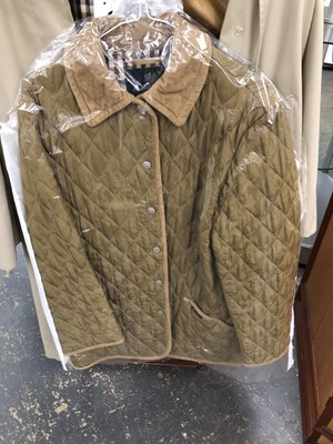 Lot 1154 - An Aquascutum trench coat together with a...