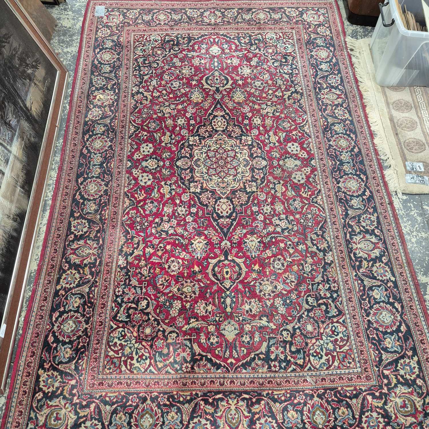 Lot 657 - A Persian Kashan rug. 217 x 137 cm.