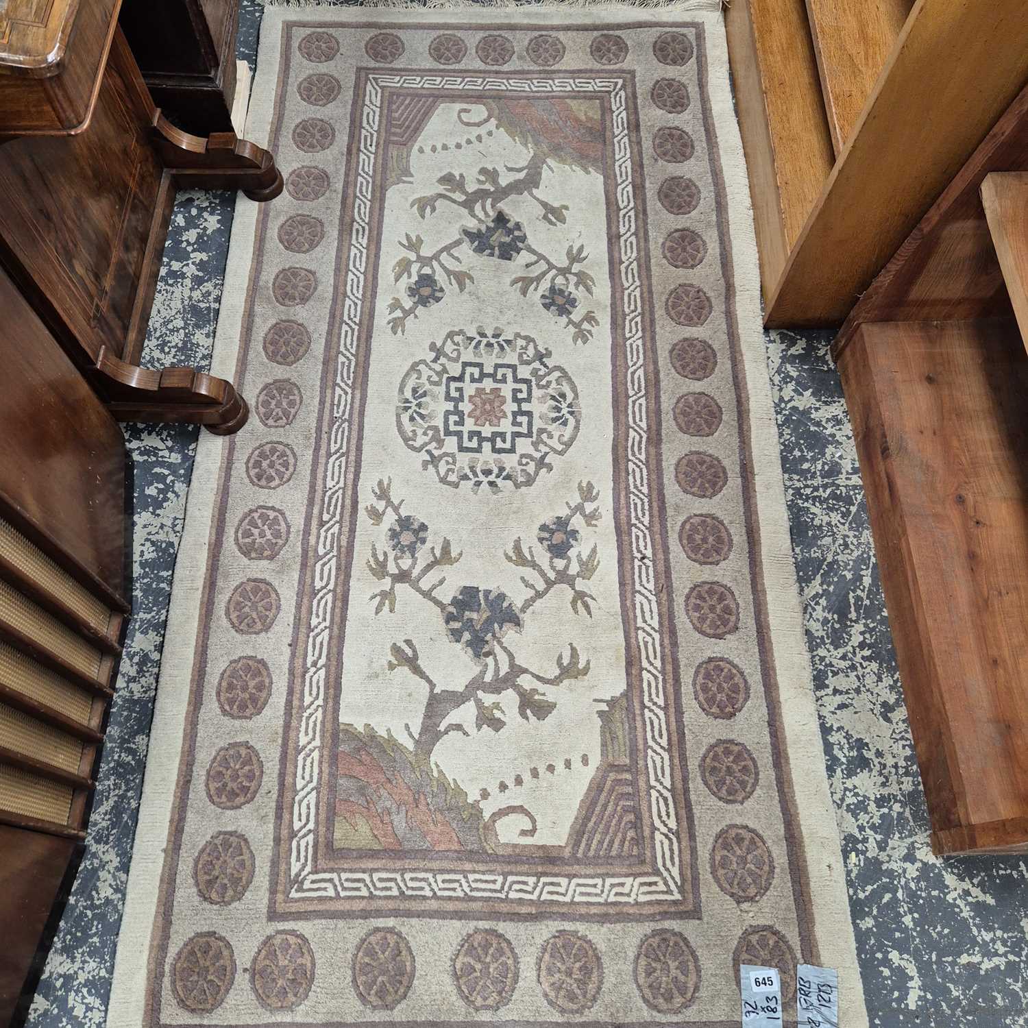 Lot 645 - A Tibetan rug of Chinese design 183 x 92 cm