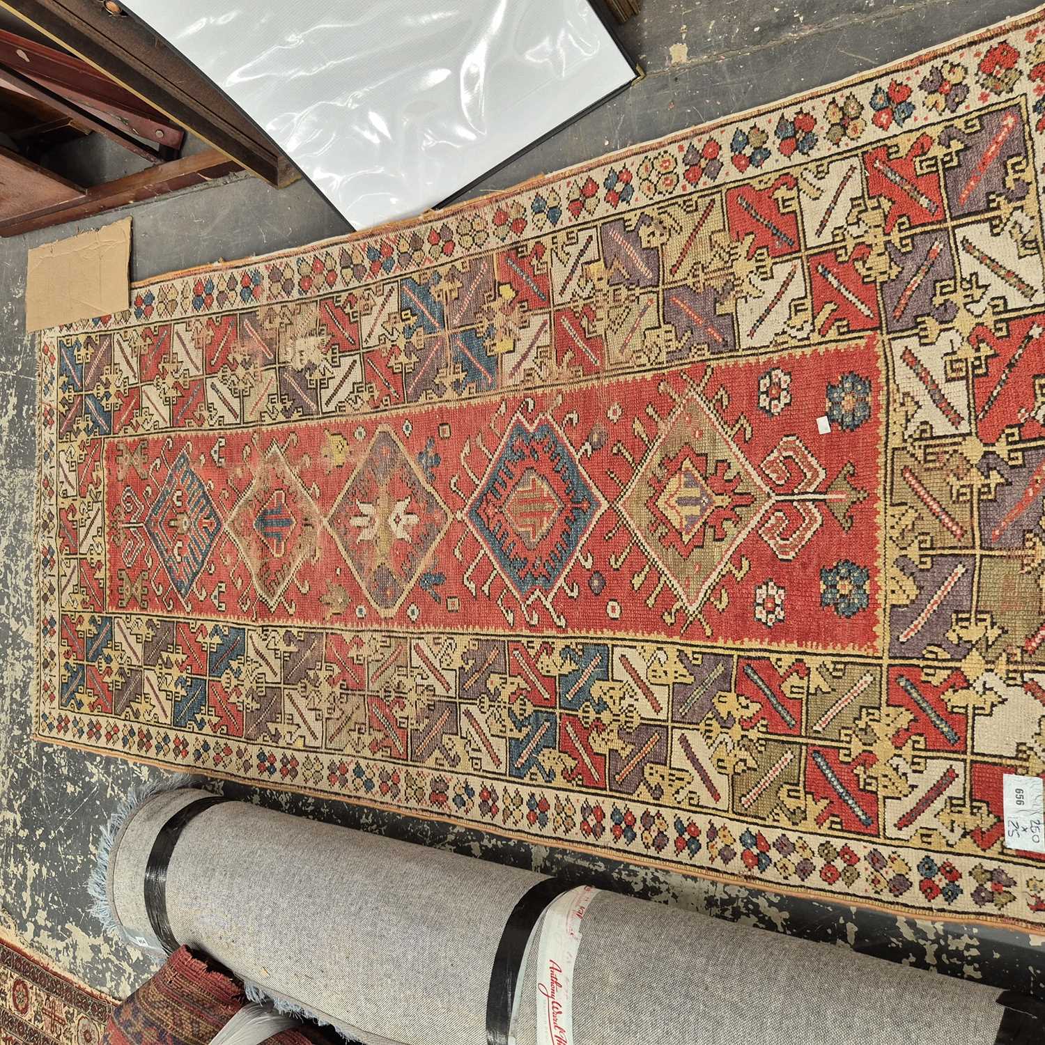 Lot 656 - An antique Turkish melas rug 250 x 125 cm