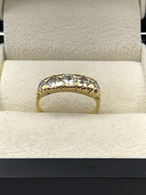 Lot 1043 - A vintage five-stone graduated diamond ring....
