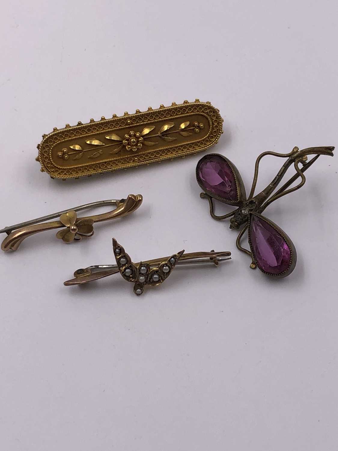 Lot 1045 - A collection of four vintage brooches,...