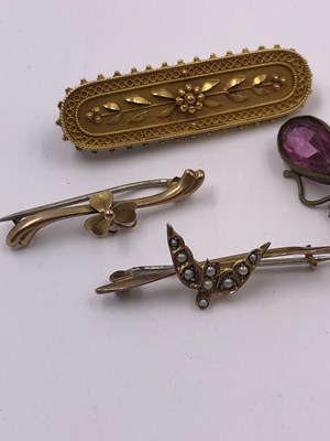 Lot 1045 - A collection of four vintage brooches,...