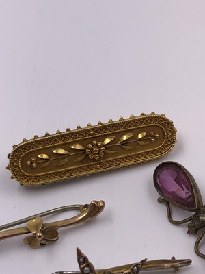 Lot 1045 - A collection of four vintage brooches,...