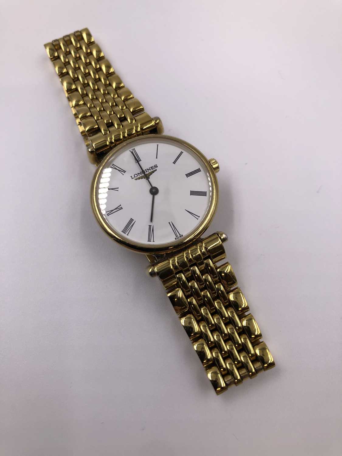 Lot 1055 - A ladies' Le Grande Classique De Longines gold-...