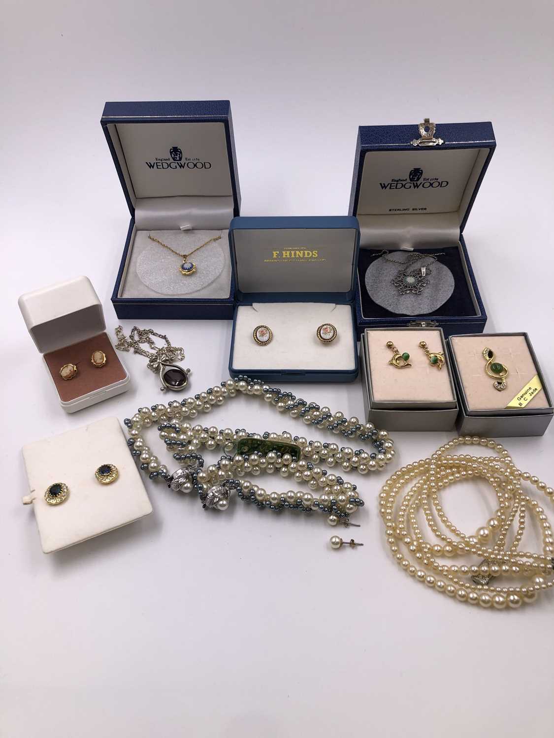 Lot 1027 - A pair of 9ct gold decorative stud earrings,...