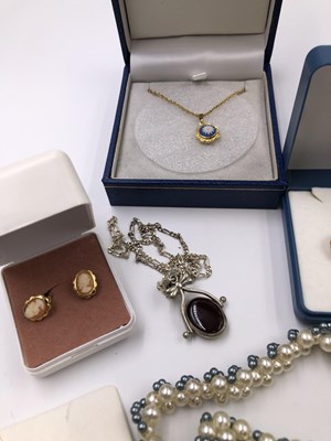 Lot 1027 - A pair of 9ct gold decorative stud earrings,...