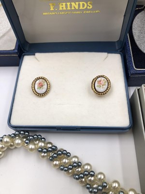 Lot 1027 - A pair of 9ct gold decorative stud earrings,...