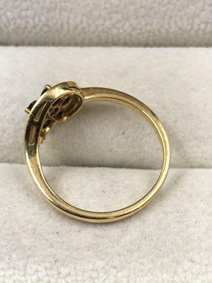 Lot 1029 - A blue gemset floral cluster ring, stamped 18c,...