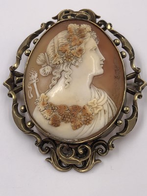 Lot 1035 - A porcelain and gold portrait brooch,...