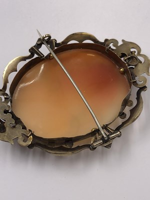 Lot 1035 - A porcelain and gold portrait brooch,...