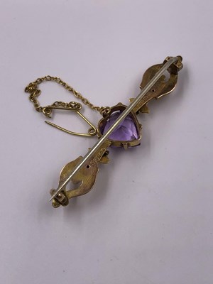 Lot 1013 - An antique gem set heart cut 9ct gold bar...