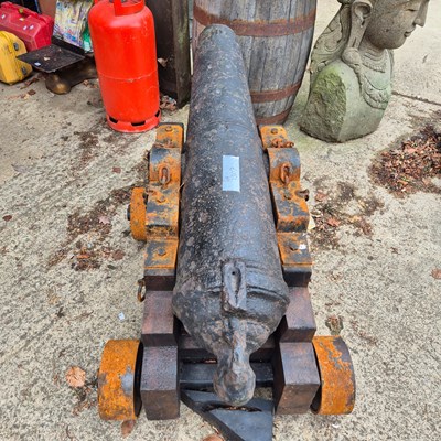 Lot 1307 - An impressive 18th century iron cannon on a...