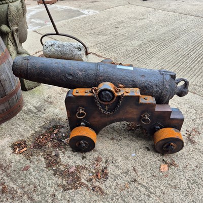 Lot 1307 - An impressive 18th century iron cannon on a...