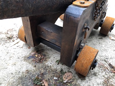 Lot 1307 - An impressive 18th century iron cannon on a...