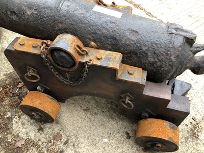 Lot 1307 - An impressive 18th century iron cannon on a...