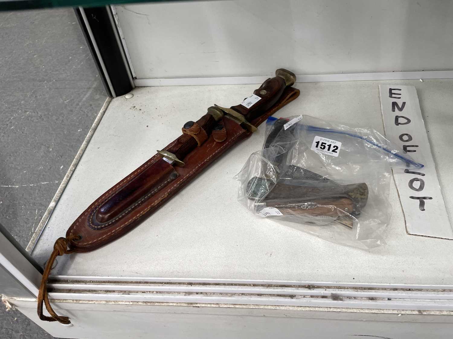 Lot 1512 - A Spanish Bowie knife in a leather scabbard...