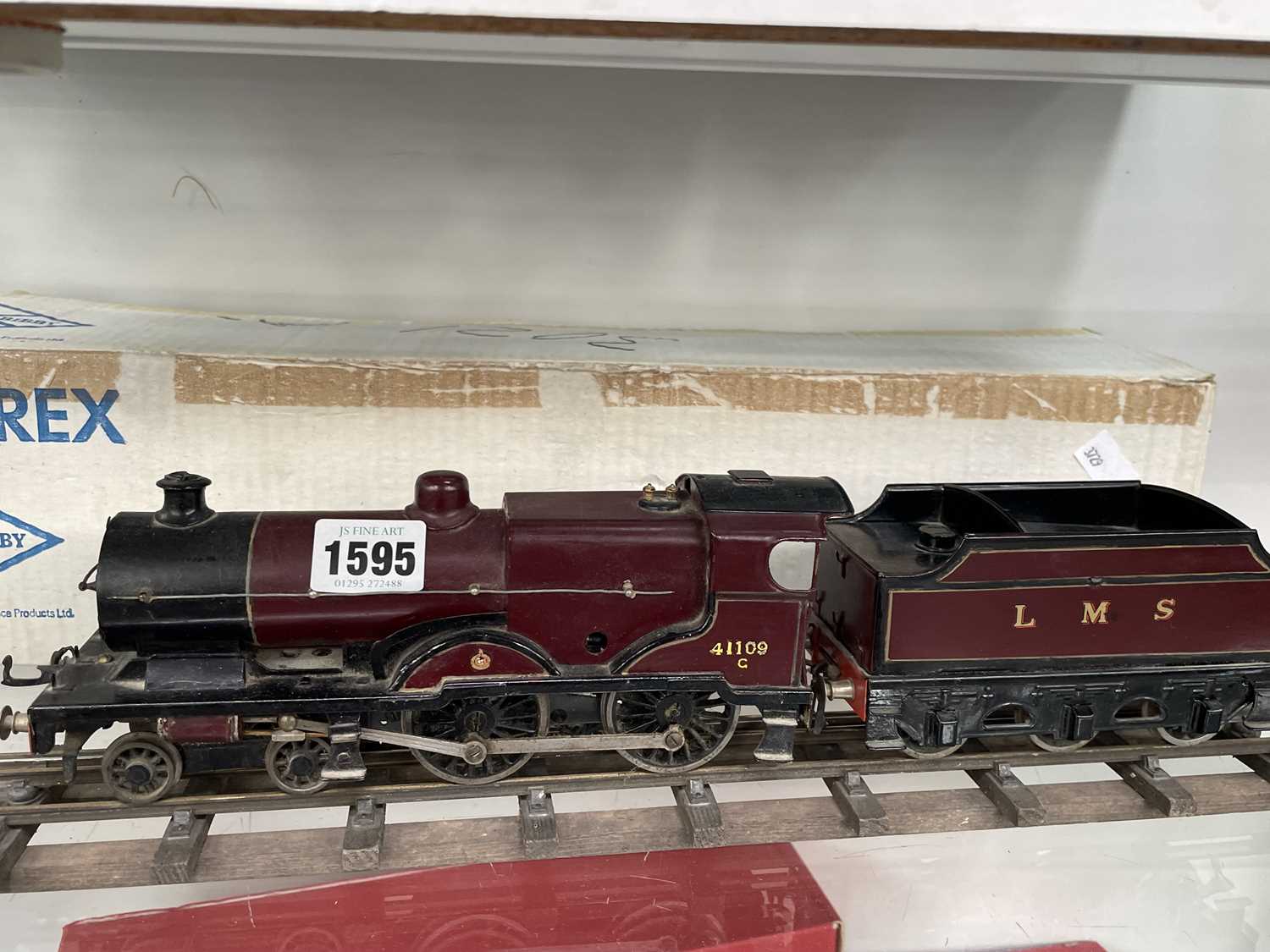 Lot 1595 - An 0 guage clock work LMS locomotive and tender