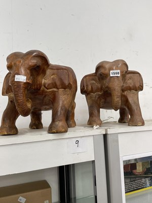 Lot 1598 - A pair of carved wood elephant figures